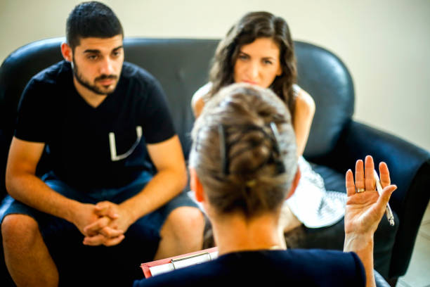 istock Young couple with a problem to consult a psychologist 830512442
