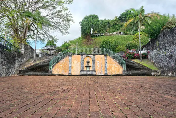 Entrance to old amphitheater in saint Pierre, Martinique. The Amphitheater is now in ruins, as big part of the area had been damaged by Mt Pelee volcano eruption in 1932 and abandoned.