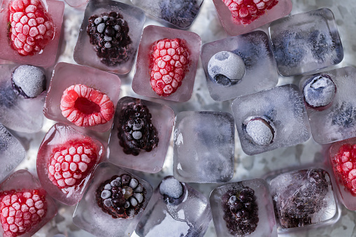Fruit ice cubes with organic berries.