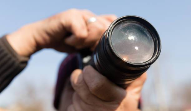 istock A large lens in the camera of a man 830553448