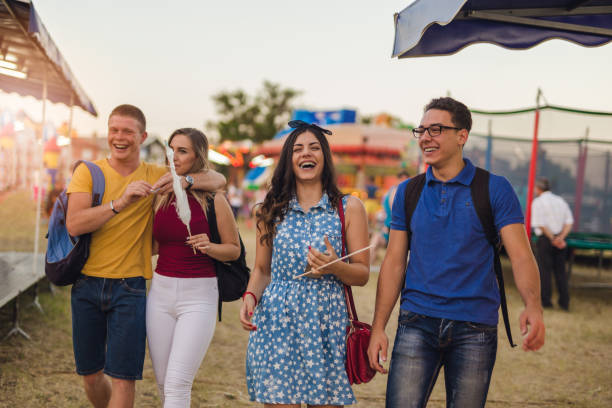 istock Friends having a good day at amusement park 830581206