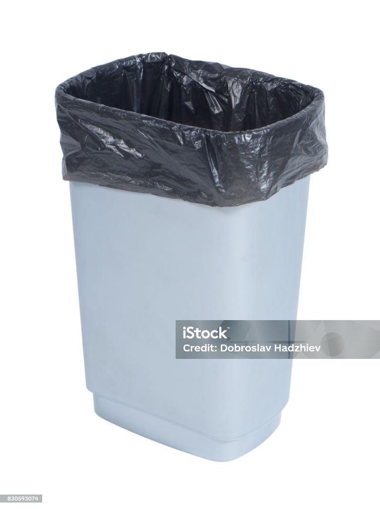 Empty trash container with black plastic bag on white background Garbage Can Stock Photo