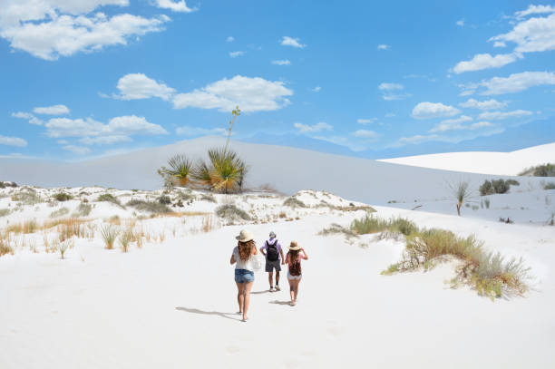 family on hiking trip on beautiful sand desert. - white sands national monument imagens e fotografias de stock
