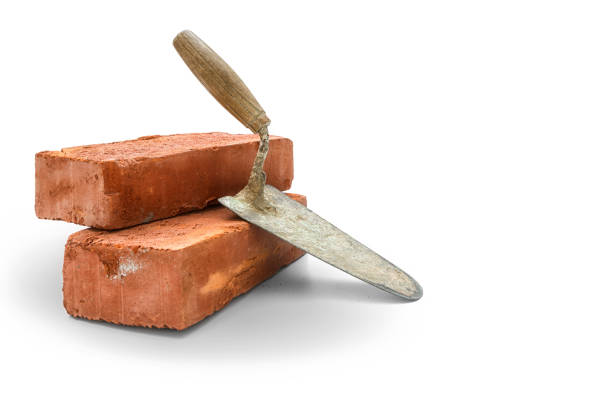 Bricks and trowel Bricks and trowel on white background,  included clipping path trowel stock pictures, royalty-free photos & images