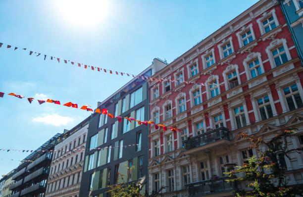 istock old and modern townhouses in a row with beautiful banners 830656516
