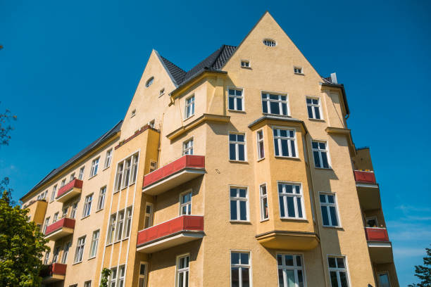istock orange corner house with clear blue sky 830657380