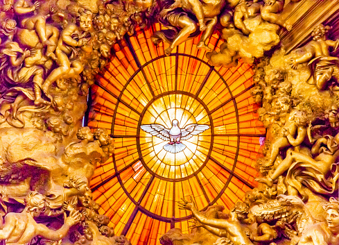 Throne Bernini Holy Spirit Dove Saint Peter's Basilica Vatican Rome Italy.  Bernini created Saint Peter's Throne with Holy Spirti Dove Stained Glass Amber in 1600s