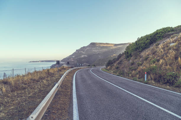 istock Road by the sea with blue sky 830669194
