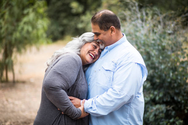 Beautiful Senior Mexican Couple An attractive senior mexican couple together in nature fat mexican man pictures stock pictures, royalty-free photos & images