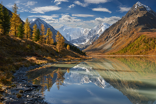 Landscape of Roerich. Akkem Valley. In the background is Belukha Mountain. A beautiful autumn landscape, a view of the mountain lake, Russia, Siberia, Altai, Katunsky ridge.