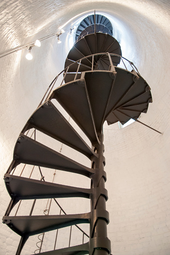 Spiral stairs leading to the top of historic Key West town lighthouse (Florida).