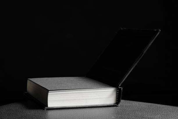 istock Hardcover book in black background 830720898