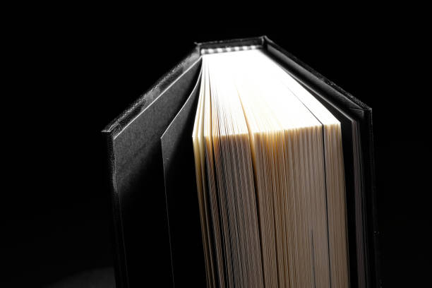 istock Hardcover book in black background - Soft focus 830721058