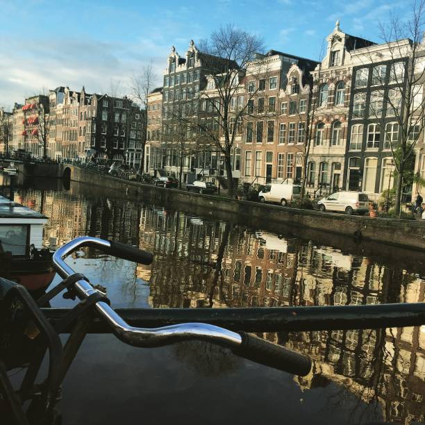istock Amsterdam Netherlands Canal View Bicycle 830730560