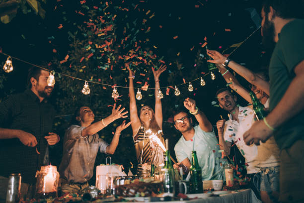 istock Group of young friends having fun at birthday party 830737726