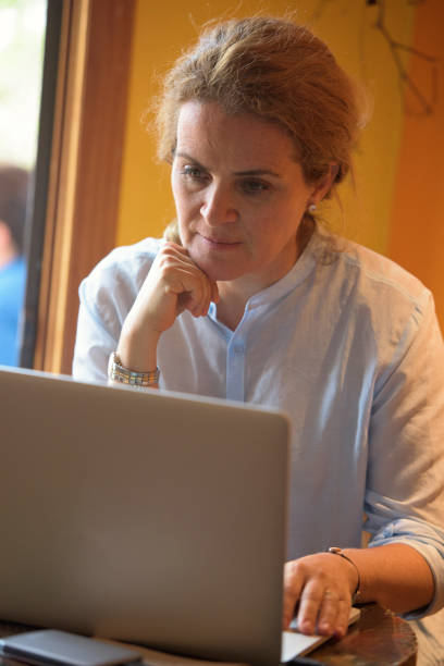 istock Mature woman using her laptop 830738830