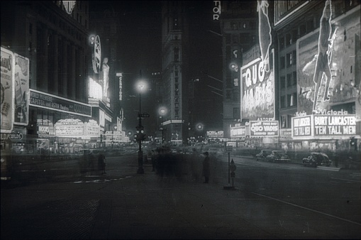 New York City, NY, USA, 1951. Times Square with its cinemas and theaters at night. Broadway and Seventh Avenue are also intersected here.