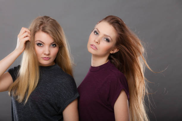 Teen models, play and enjoy, during makeup session.