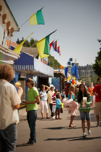 The annual Arts and Crafts Street Fair with vendors selling food, gifts and art products along main street Sherman Avenue, and through city park in the lakefront tourist resort town of Coeur d'Alene, Idaho.