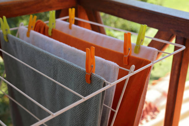 istock Laundry drying , clean colorful towels on a laundry line outdoors 830832888