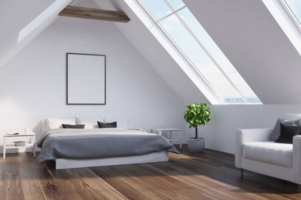 istock Attic bedroom with a gray bed, poster, side 830848664