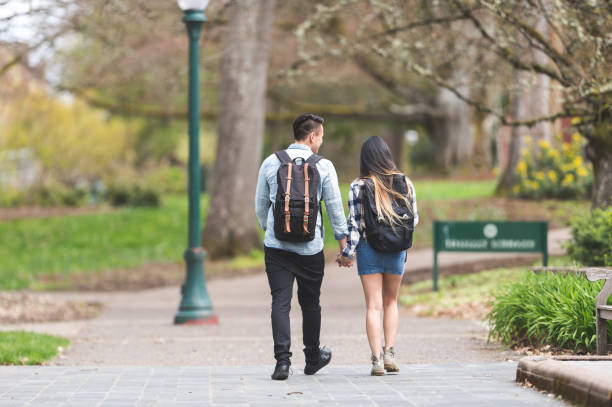 istock Cute young Asian couple on date 830849004