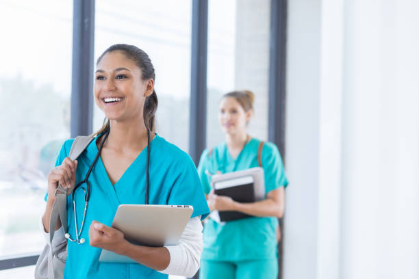 istock Cheerful female nursing student walks to class 830863218
