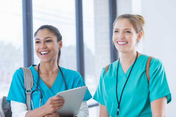 istock Female medical interns walk to class together 830863246
