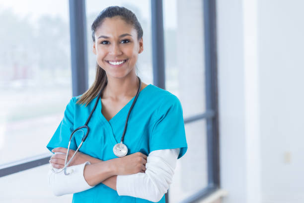 istock Confident nurse in hospital hallway 830863256