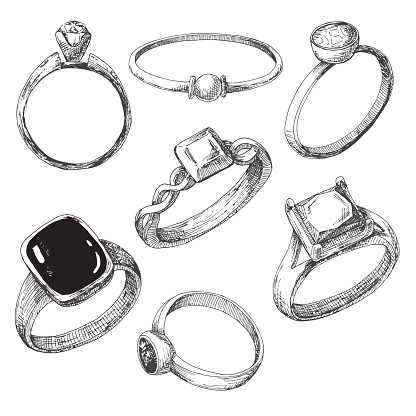 Hand drawn a set of different jewelry rings. Vector illustration of a sketch style.