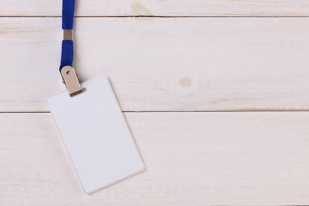 istock Blank Identification Card with Neckband on White Wooden Background 830873144