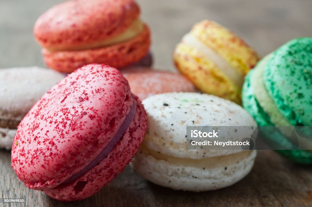 assortment of french macarons on wooden background Bakery Stock Photo