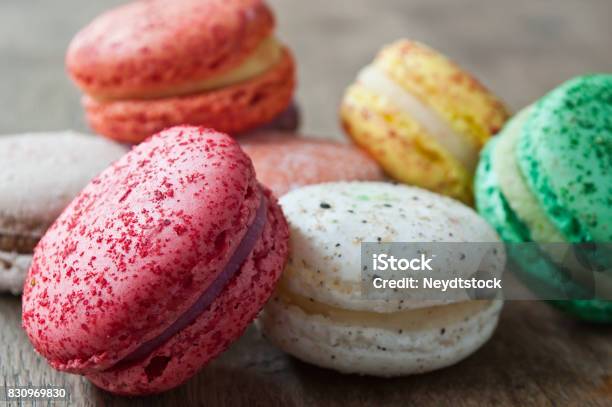 Assortment Of French Macarons On Wooden Background Stock Photo - Download Image Now - Bakery, Brown, Cafe