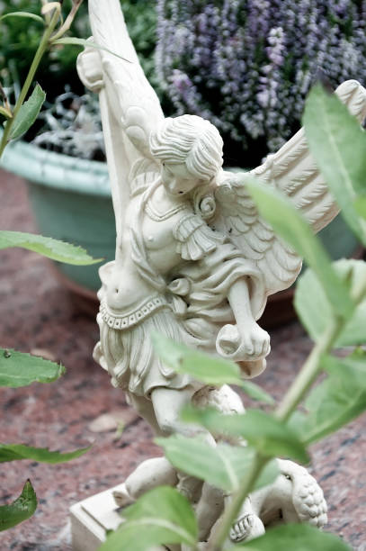 istock white angel in cemetery on a tomb 830976036