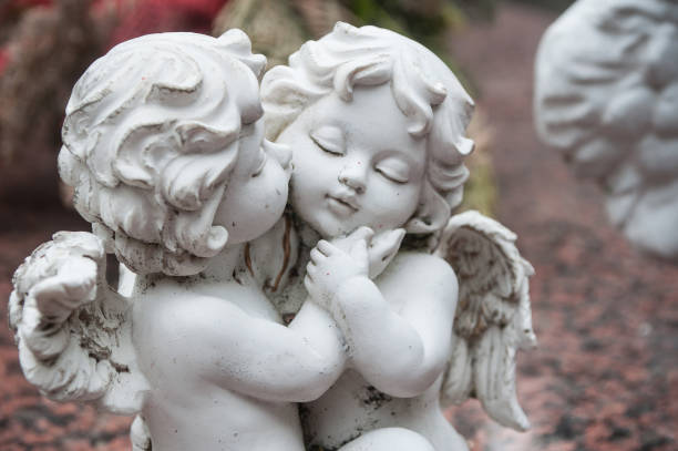 istock white angel in cemetery on a tomb 830978912