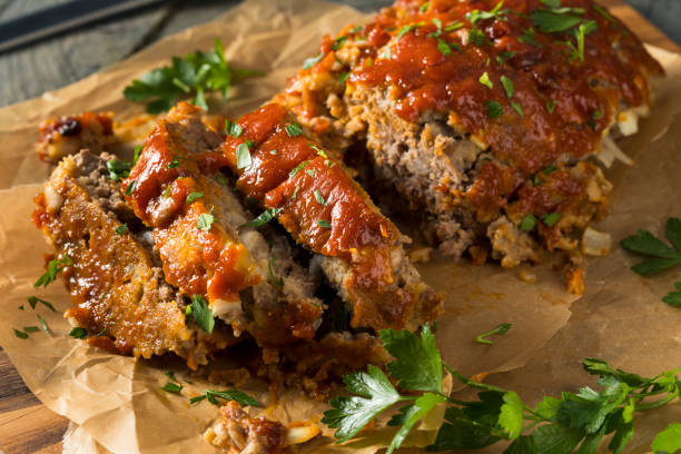 Homemade Savory Spiced Meatloaf Homemade Savory Spiced Meatloaf with Onion and Parsley MEATLOAF stock pictures, royalty-free photos & images