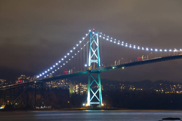 istock Night long exposure shot of bridge with glowing lights 830991408