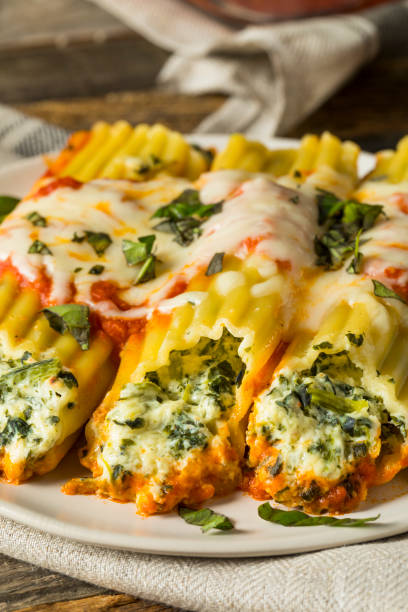 istock Homemade Stuffed Ricotta and Spinach Manicotti 830995420