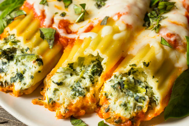 istock Homemade Stuffed Ricotta and Spinach Manicotti 830995496