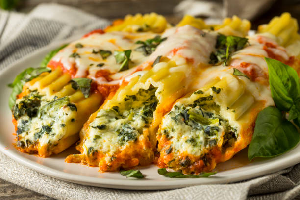 istock Homemade Stuffed Ricotta and Spinach Manicotti 830995510
