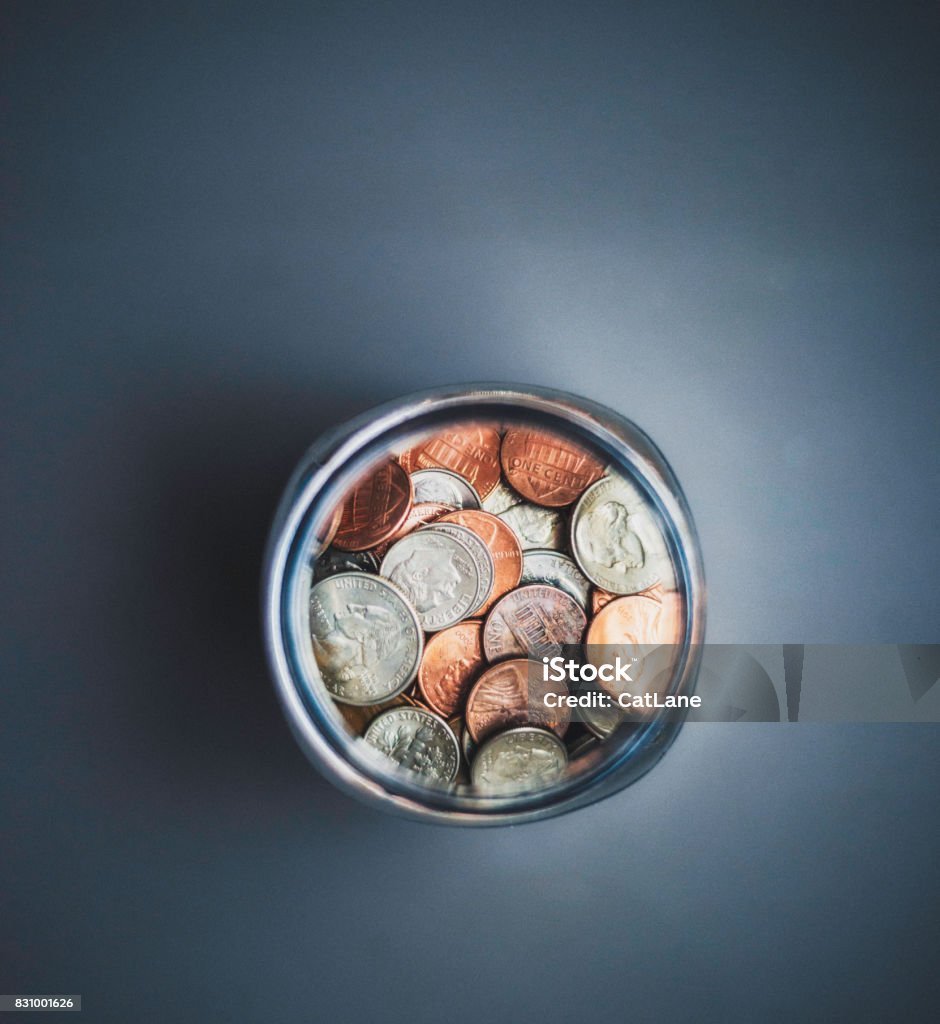 Savings jar filled with cash Jar Stock Photo