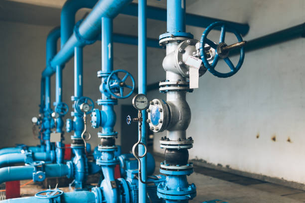 istock steel pipelines and cables in a plant 831002302
