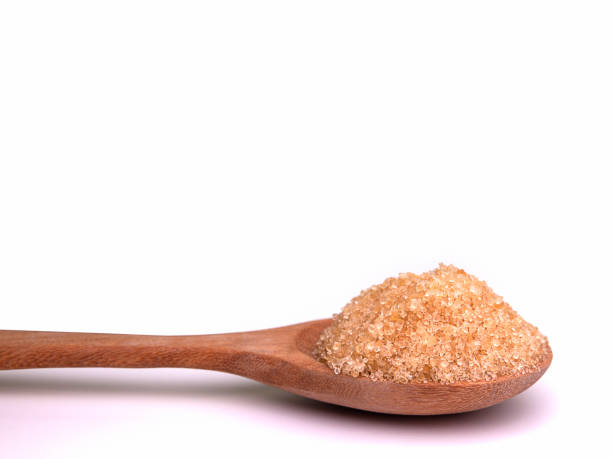 istock Sugar In a wooden spoon. 831004922