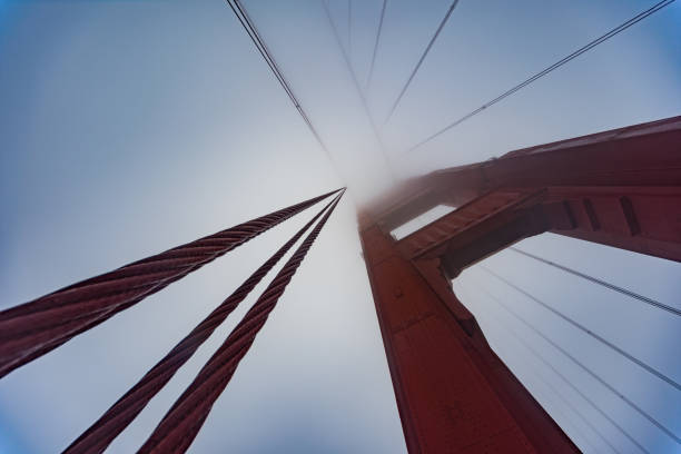 looking up at the ggb - san francisco county bridge california fog imagens e fotografias de stock
