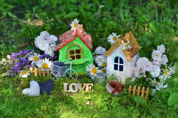 istock Two houses with decorations, love letters, flowers and berries 831009892