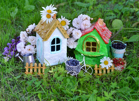 Lovely miniature houses for greeting cards, wedding or birthday concept, real estate, downsizing, home ownership. Vintage summer background