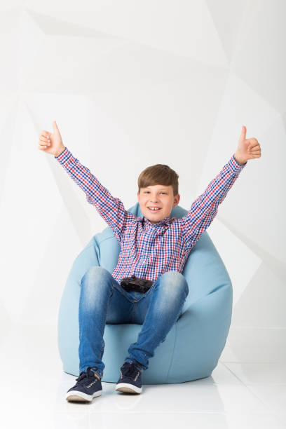 istock child hold gamepad in his hands. play video games 831013072