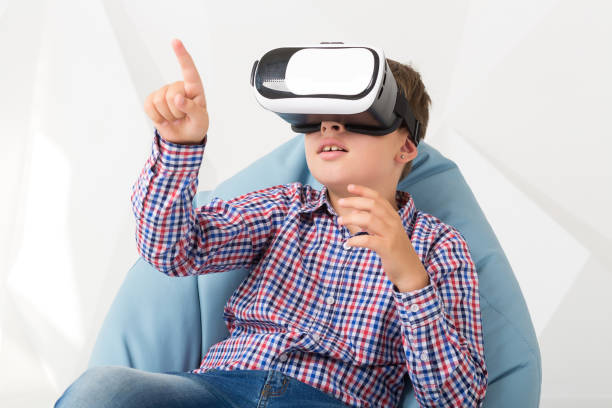 istock Emotional boy in virtual reality glasses on white background 831013142