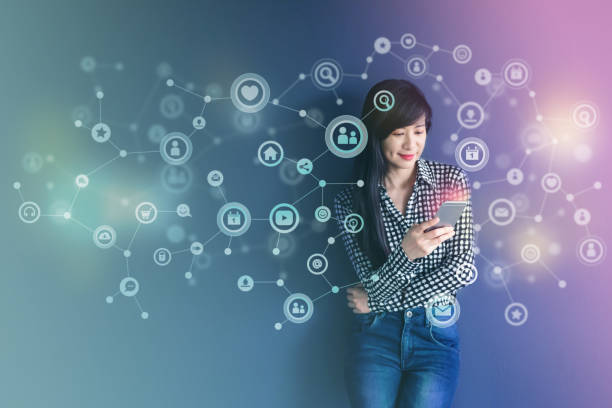 istock Communication Technology on daily life via Smart Phone Concept, Social media or Network system present over Soft focus of Happy Woman standing and enjoying with them in Colorful filter 831013252