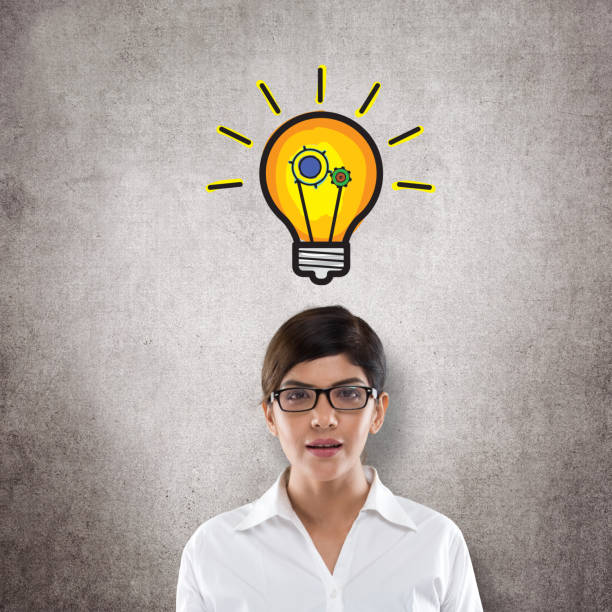 istock Businesswoman with light bulb icon 831027914